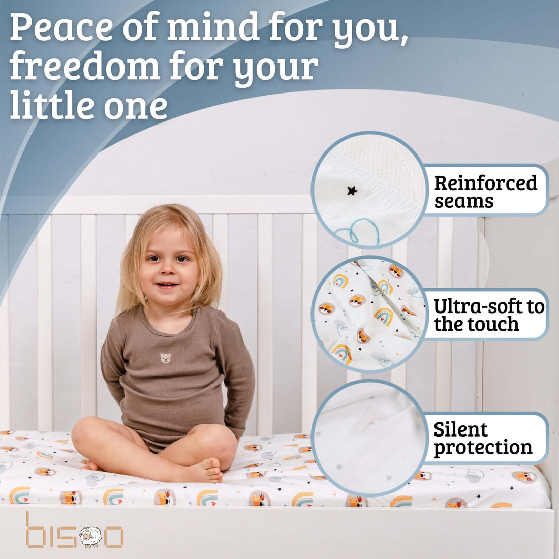 Baby sleeping peacefully on The Magic Sheet waterproof fitted crib sheet