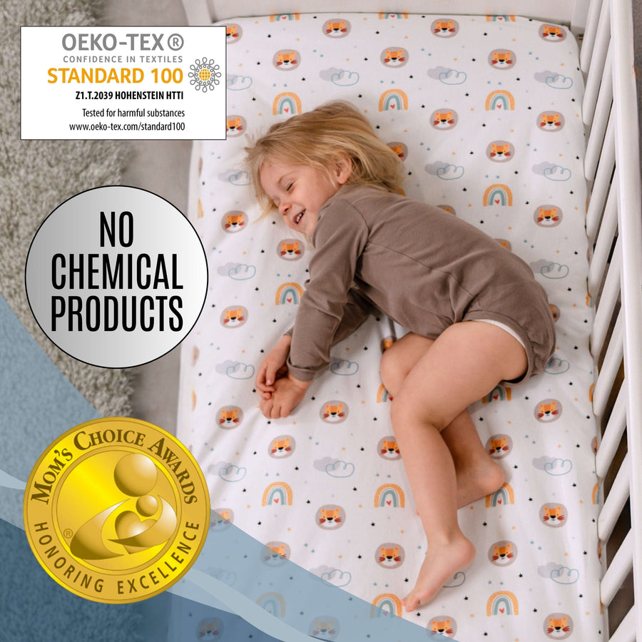Baby sleeping peacefully on The Magic Sheet waterproof fitted crib sheet