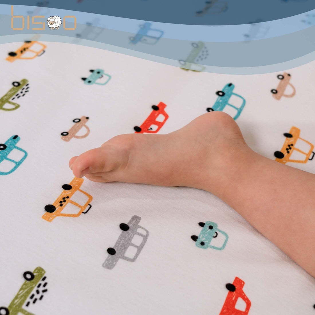 Baby sleeping peacefully on The Magic Sheet waterproof fitted crib sheet